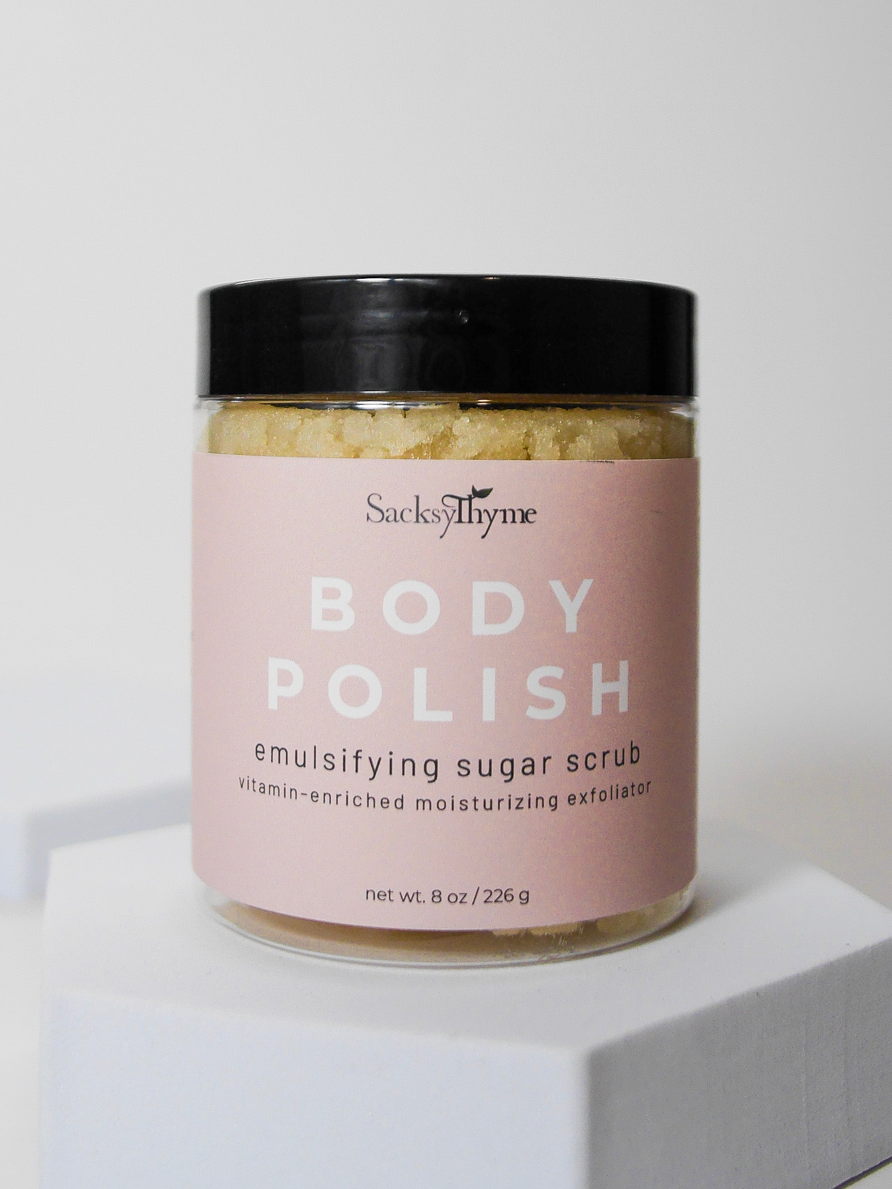 Emulsifying body polish, skin-loving ingredients, sugary exfoliation, jojoba oil, olive oil, deep hydration, shea butter, cocoa butter, luxurious moisture, vitamin E, nourish, protect, soft skin, supple skin, rejuvenated, lavender oil, bergamot oil, soothing, aromatic, skincare routine, natural goodness, revitalizing, vitamin-rich, nourishing, therapeutic, skin care, luxurious touch, self-care, revitalized.