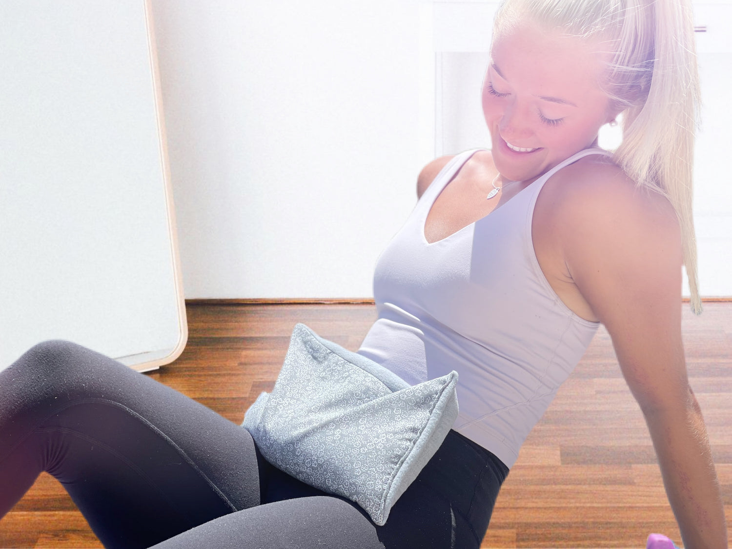 Microwavable Hot Therapy Heating Pad with flaxseed filler on stomach of model
